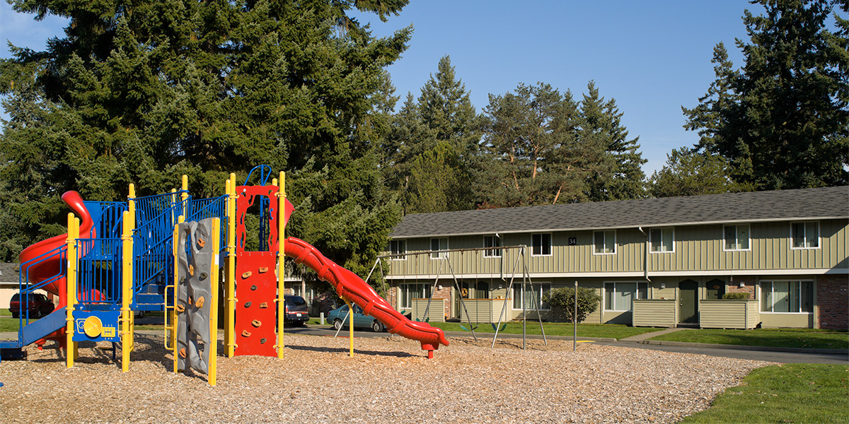 Affordable rental housing apartment complex with playground