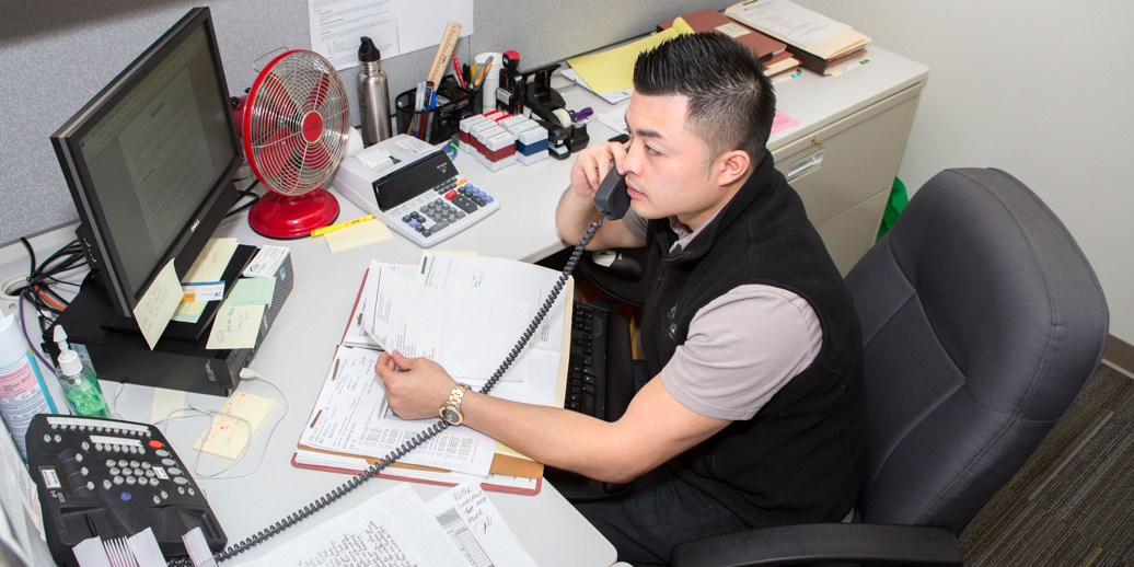 KCHA employee working at their desk